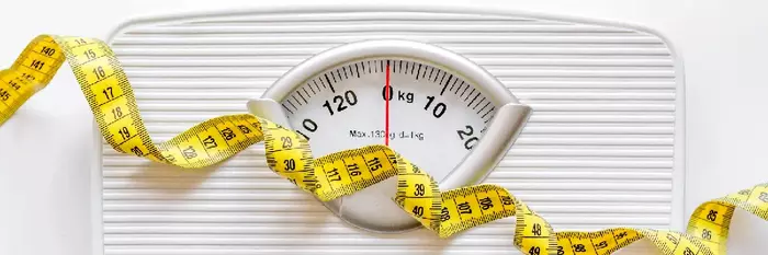 Photo of weighing scales & tape measure